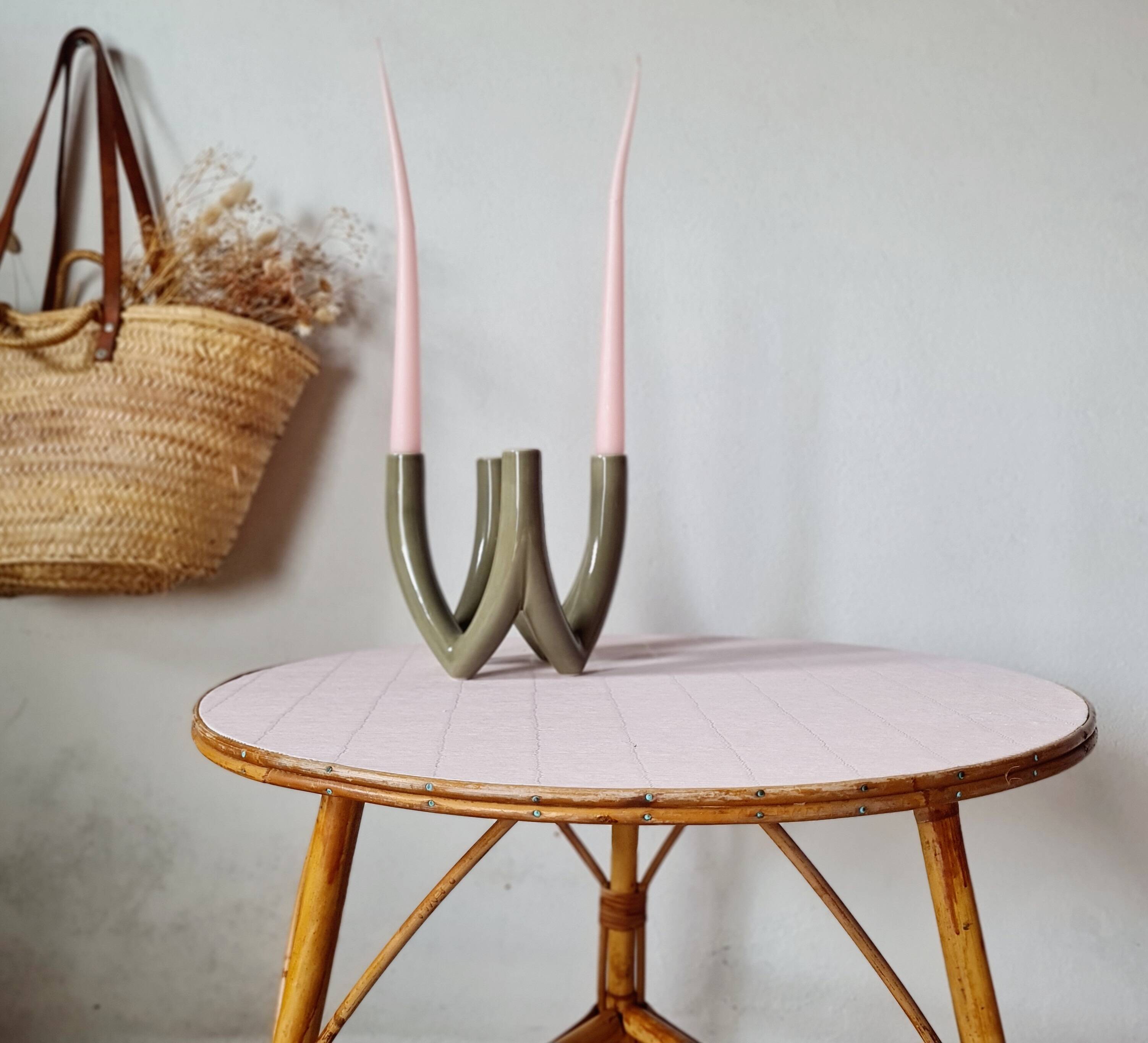 Round soft pink rattan table