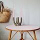 Round soft pink rattan table