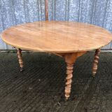 Round table in solid cherry wood, extendable with twisted legs, Louis Philippe style.