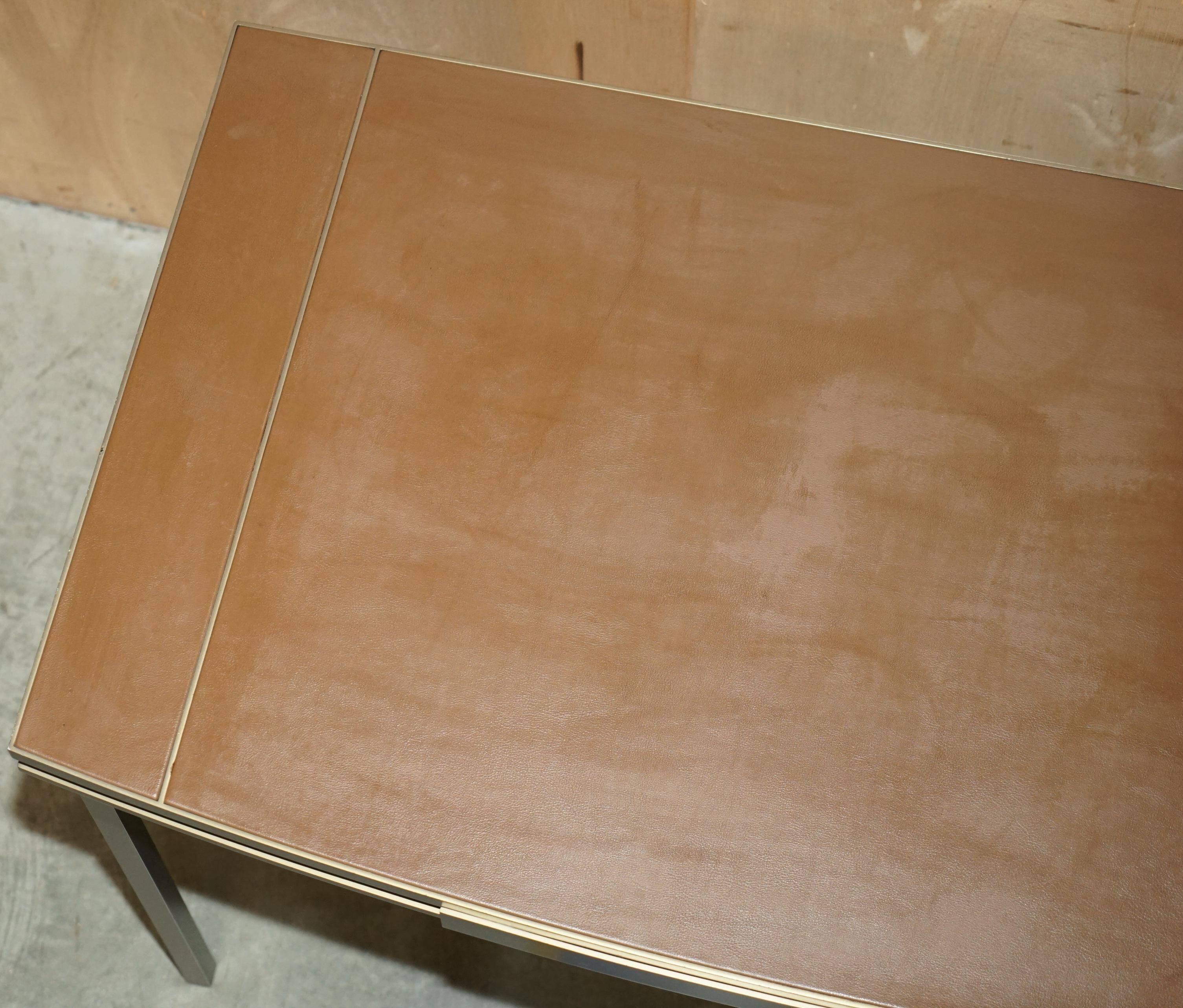 Modern mid-century writing desk signed Cartier in bronze and leather.