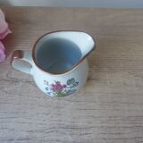 Old small artisanal milk jug in flowered speckled stoneware from the 1980s