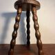 Round wooden tripod stool