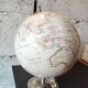 Decorative terrestrial globe on silver metal stand – explorer style