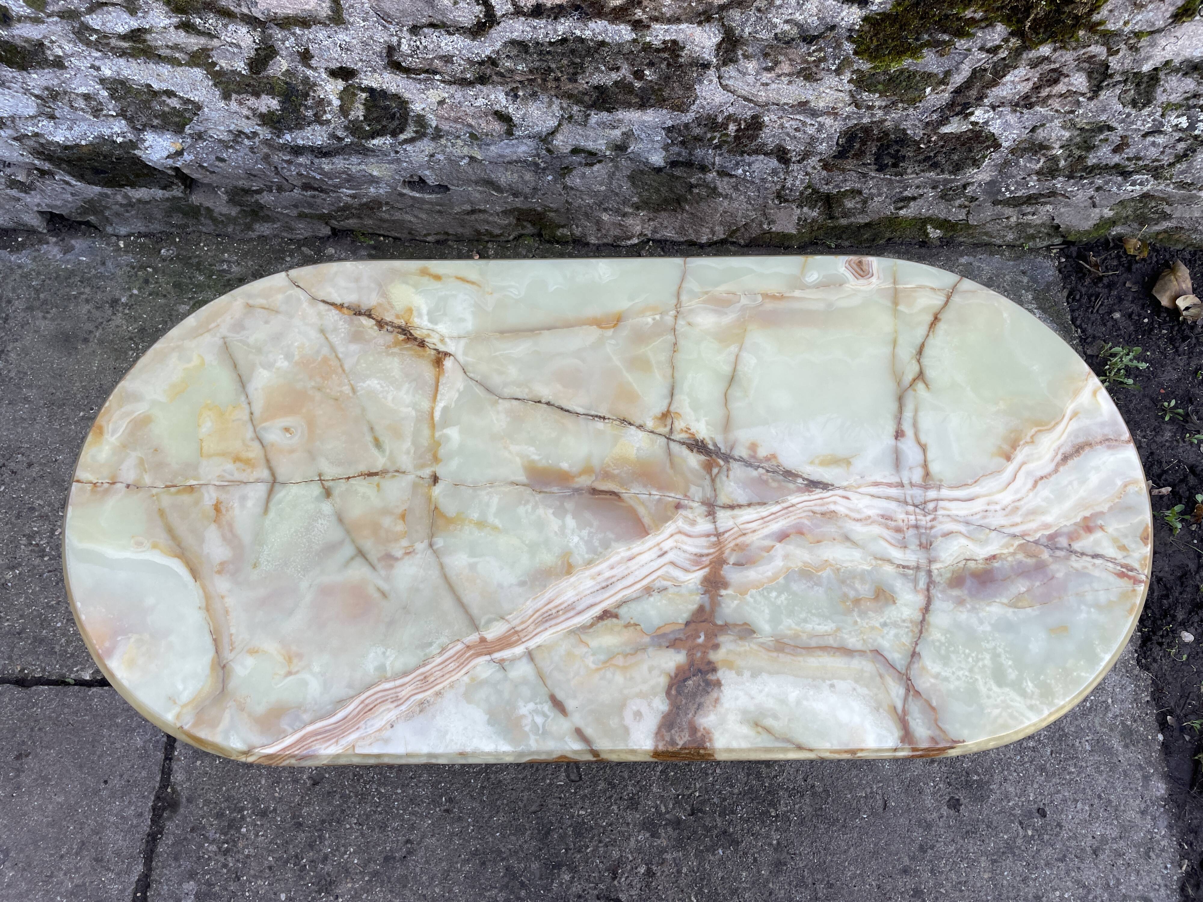 Louis XVI style oval coffee table in onyx and gilt brass