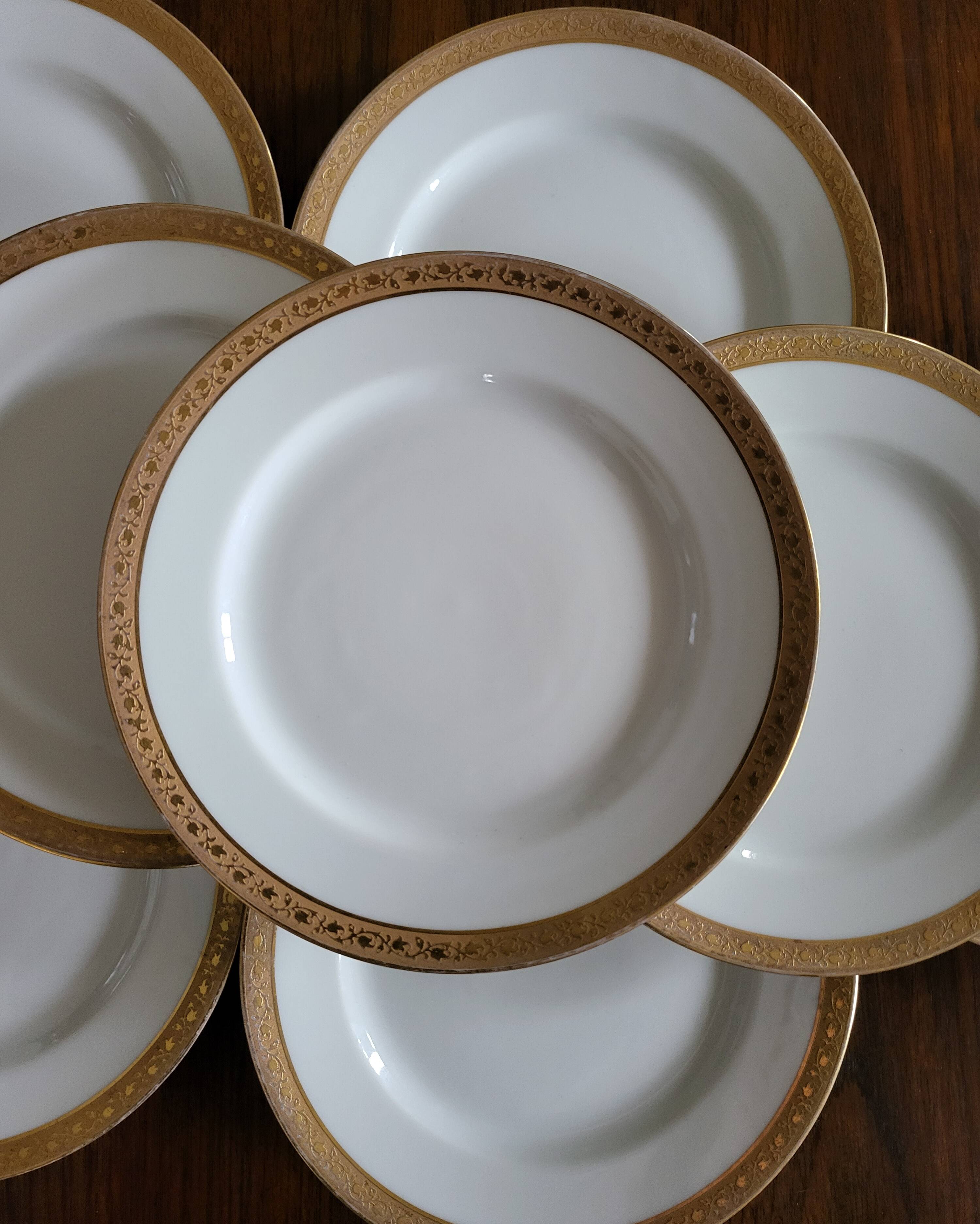 Lot of 8 small porcelain bread plates.