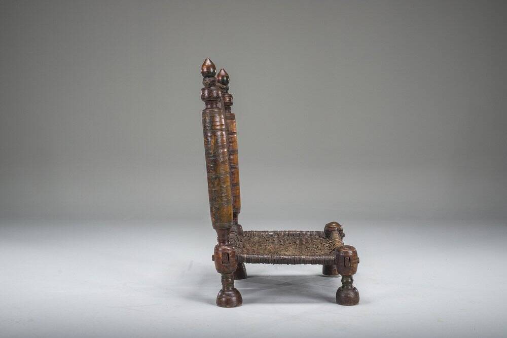 Early 20th century handmade low cedar chair, Nuristan, 1890s