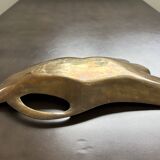 Old brass pocket emptier