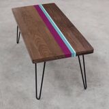 Solid oak coffee table with colored bands on pin legs
