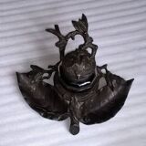 Old office ink bottle in regular art nouveau foliage