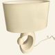 Cream ceramic table lamp with a mid-century design, featuring a lampshade.
