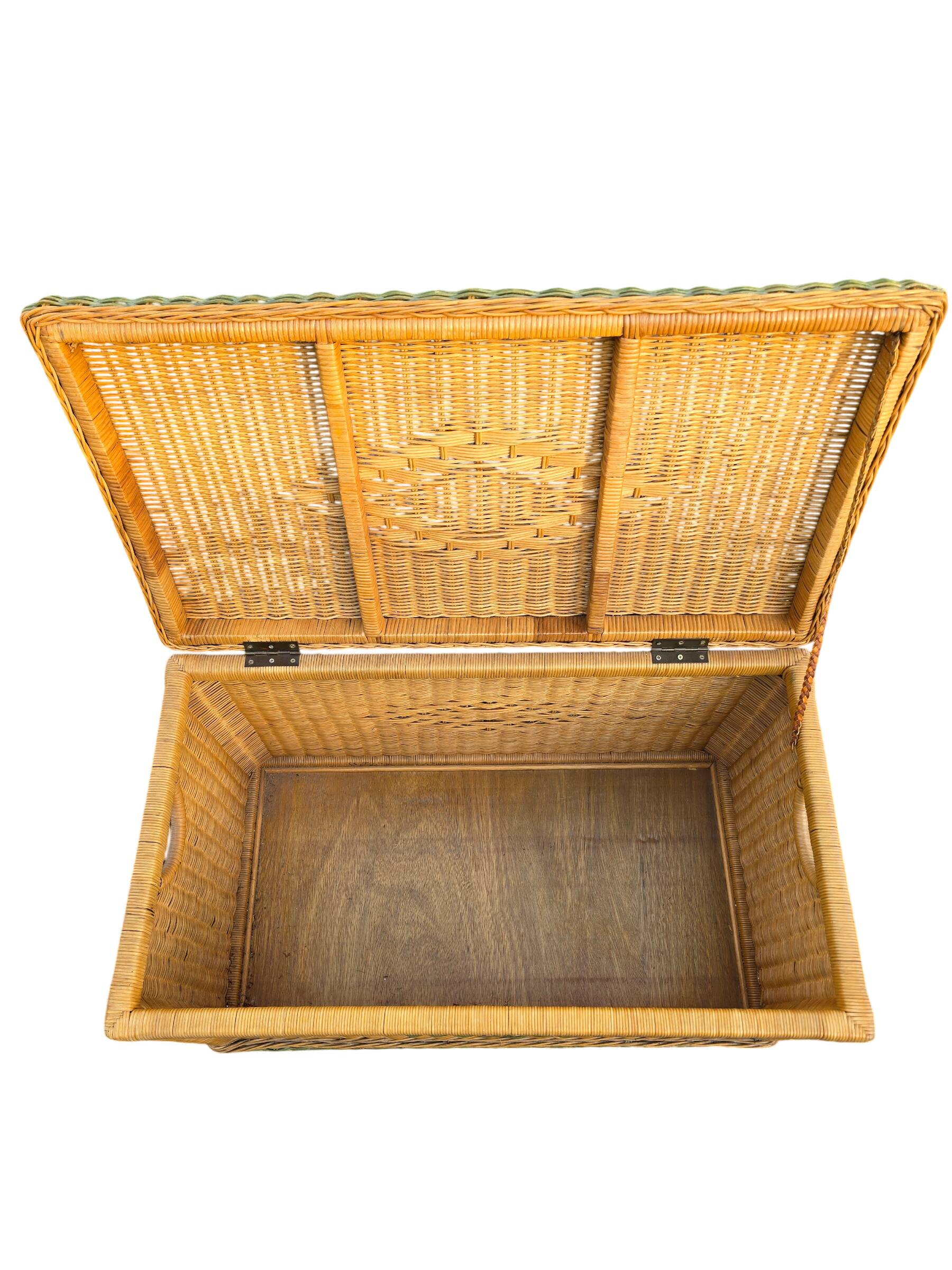 Large vintage wicker chest with green decoration.