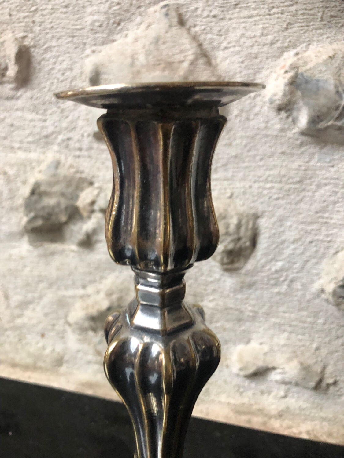 Antique candle holder in silvered bronze