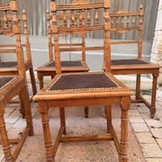 Set of 6 antique turned wooden chairs with embossed leather seats.