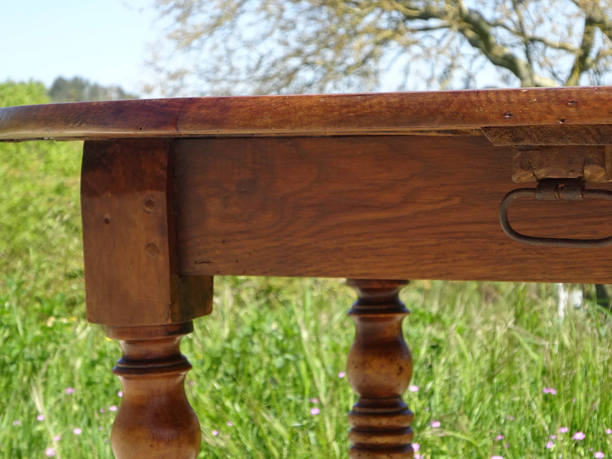 Antique walnut console table with honey spoon legs.