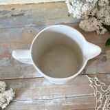 Old white earthenware jug