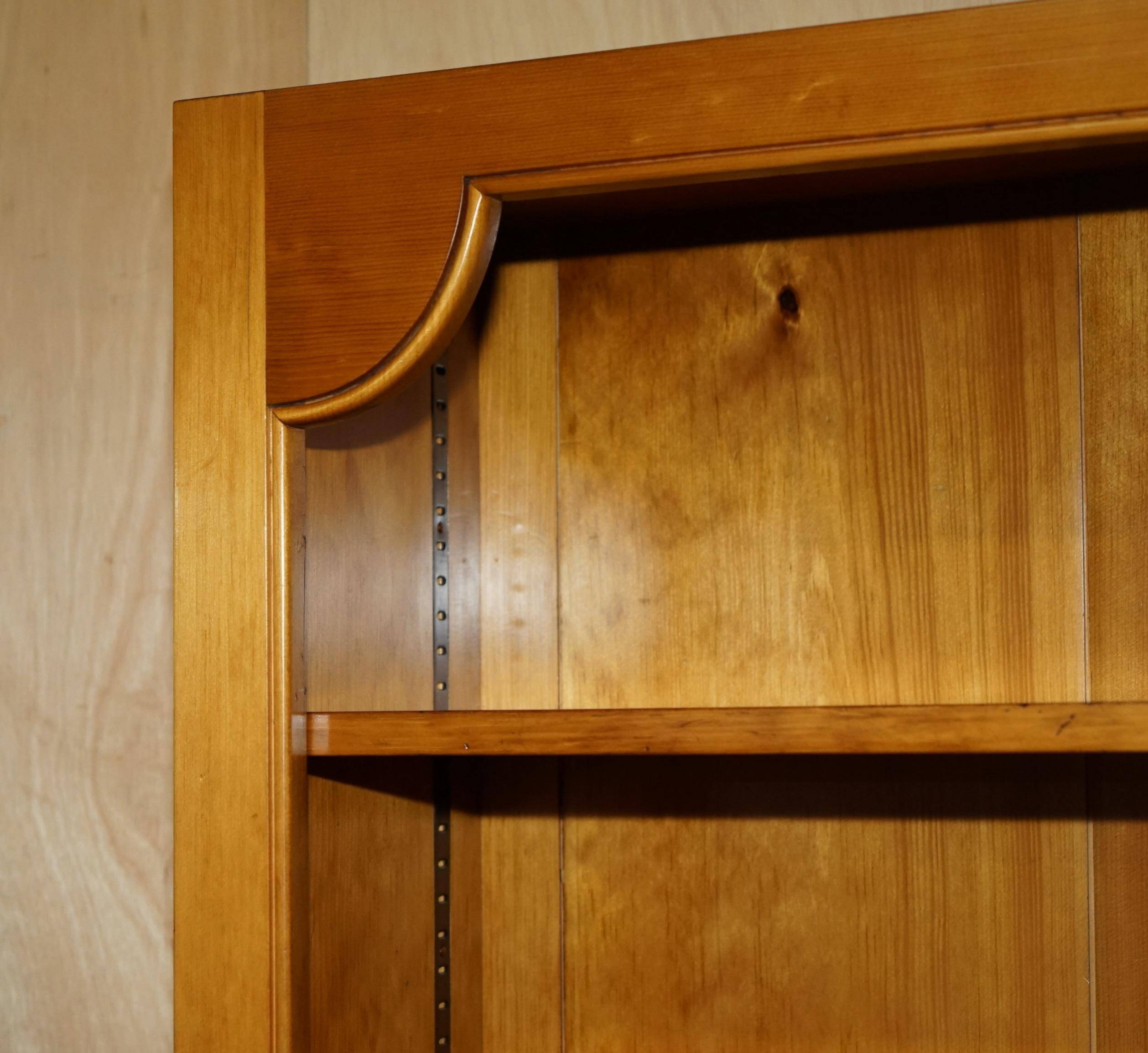 Pair of vintage cherry wood bookcases with lockable doors.