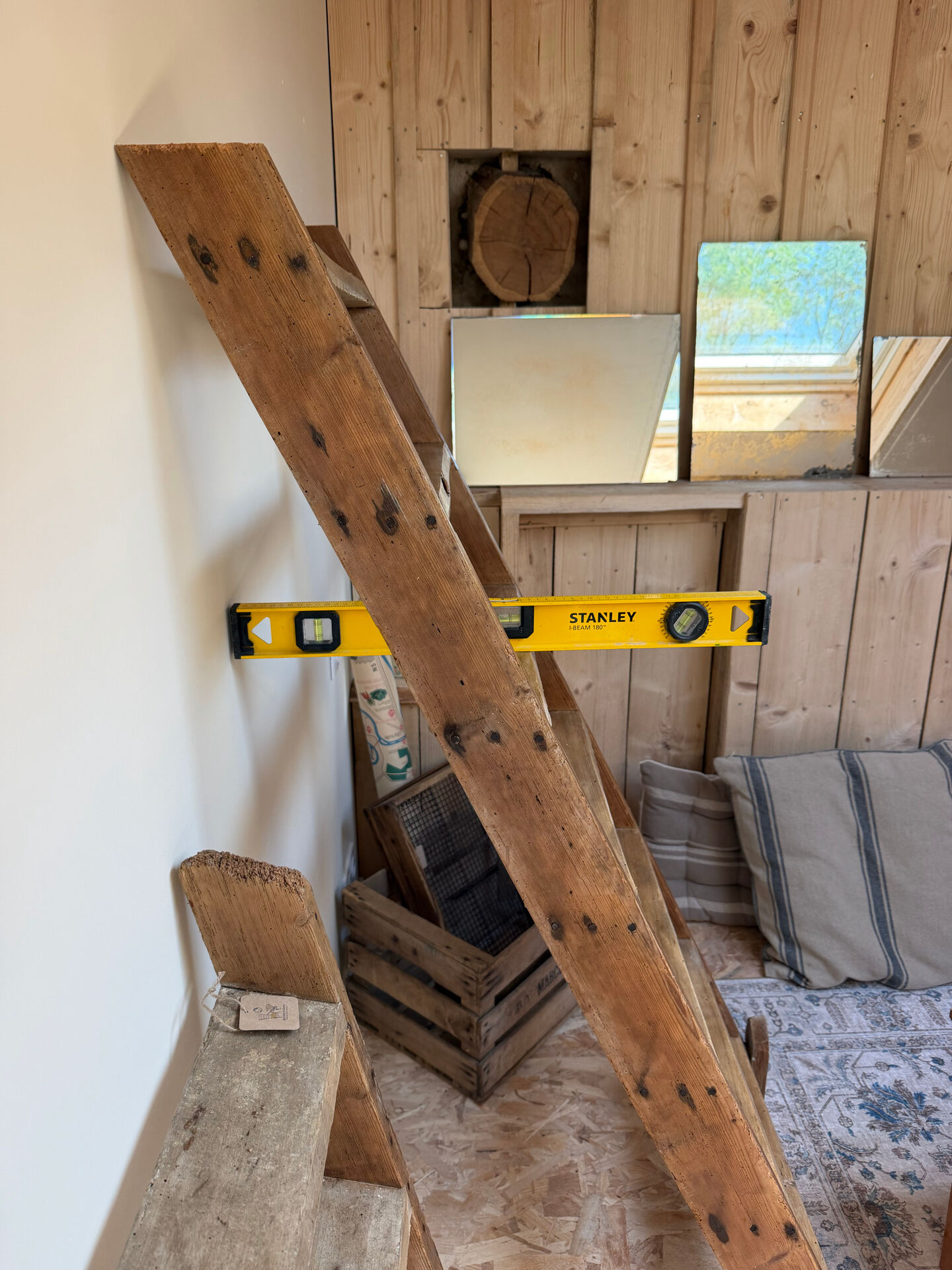 Decorative wooden ladder or towel rack.