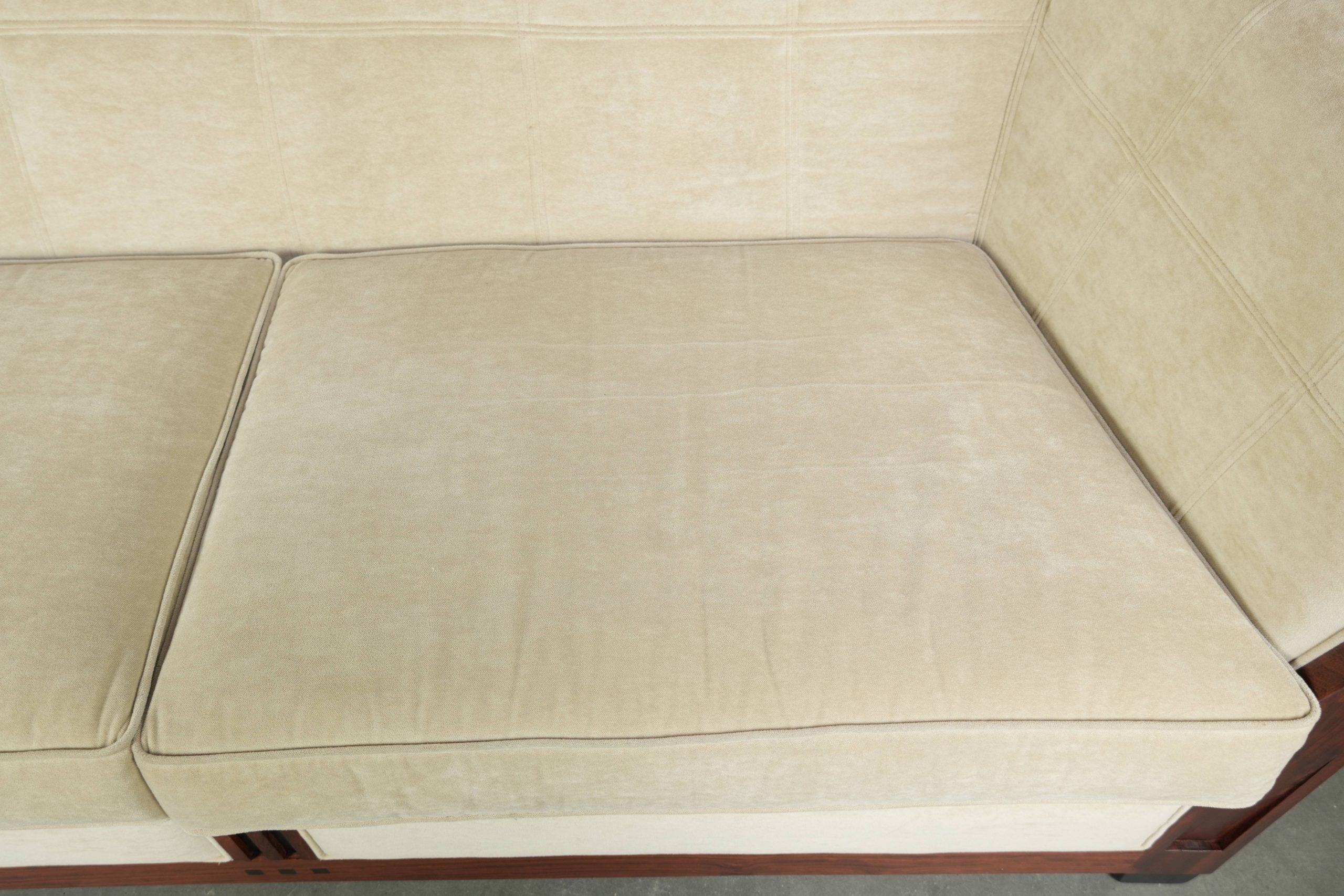 Art Deco design sofa with beautiful woodwork and cream fabric upholstery