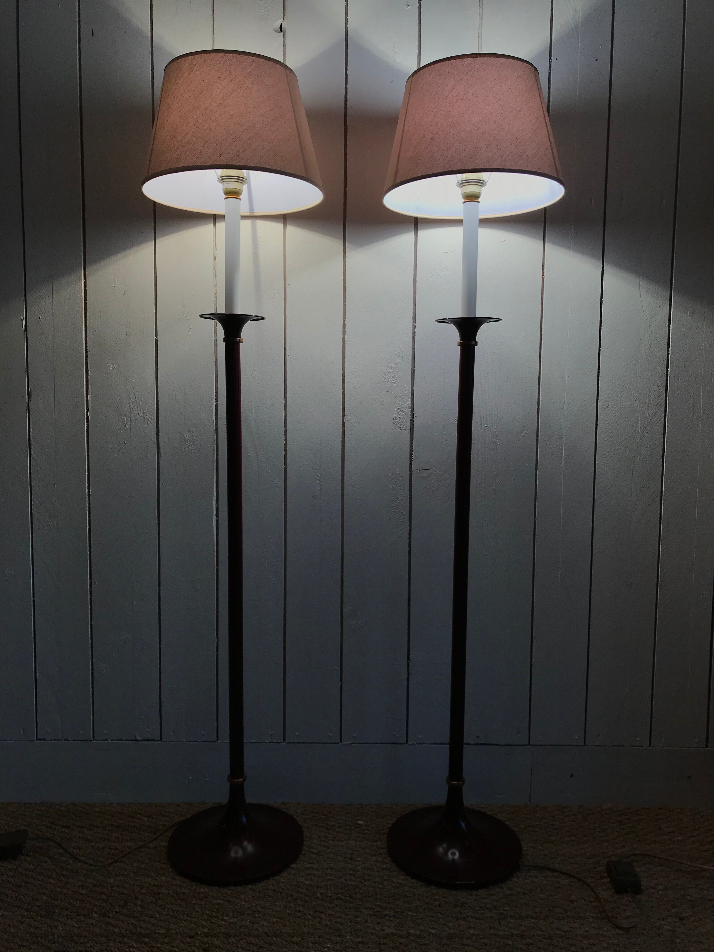 Pair of red enamelled metal floor lamps