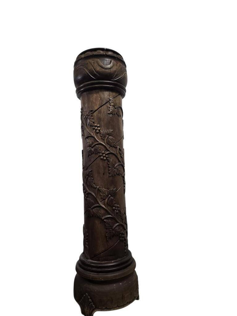 Vintage wooden column with carving