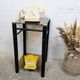 Vintage side table with two smoked glass tops and black metal.