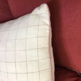 Beige linen cushion with checkered pattern and shiny pink piping