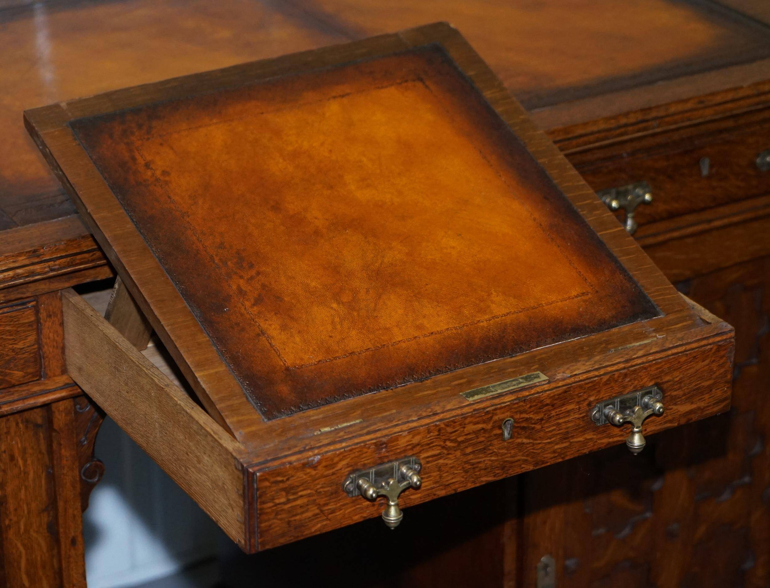 Restored Gothic desk with side bookshelves, drawer, and sloping top by Pugin Gillows.