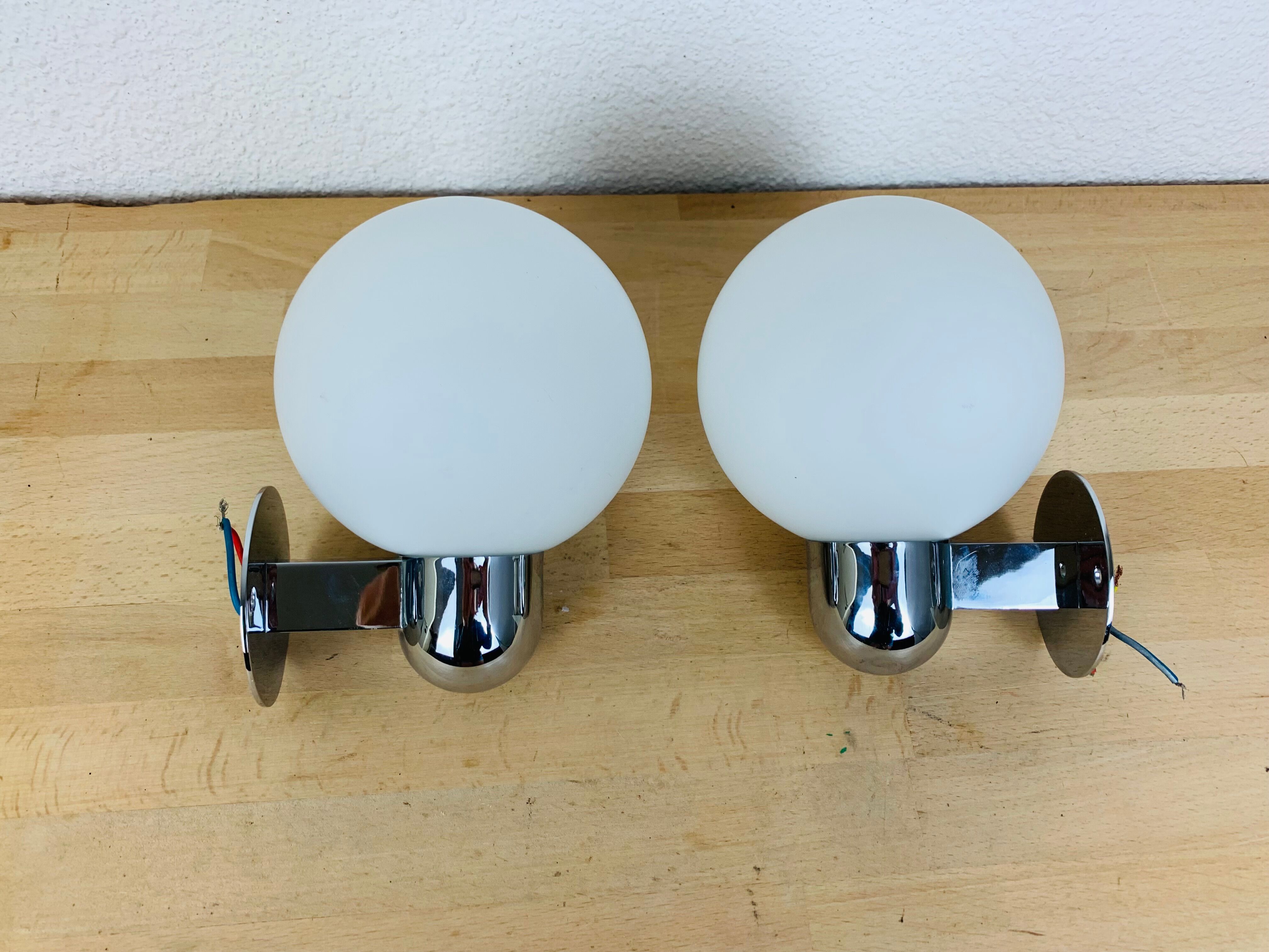 Pair of wall lamps space age chrome and opal globe 70s