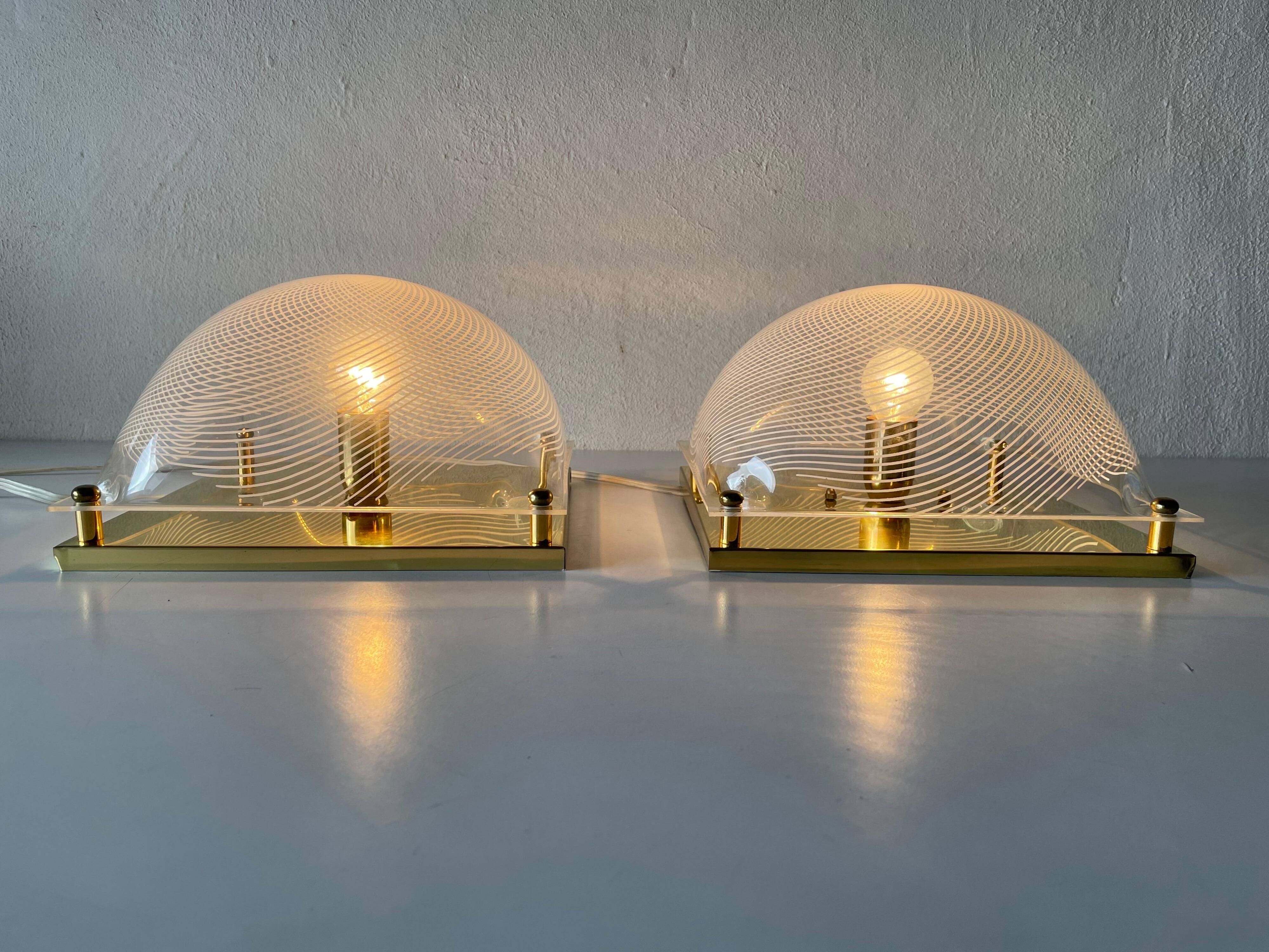 Pair of wall lights or flush mounts in plexiglass by Leola, 1970s, Germany.
