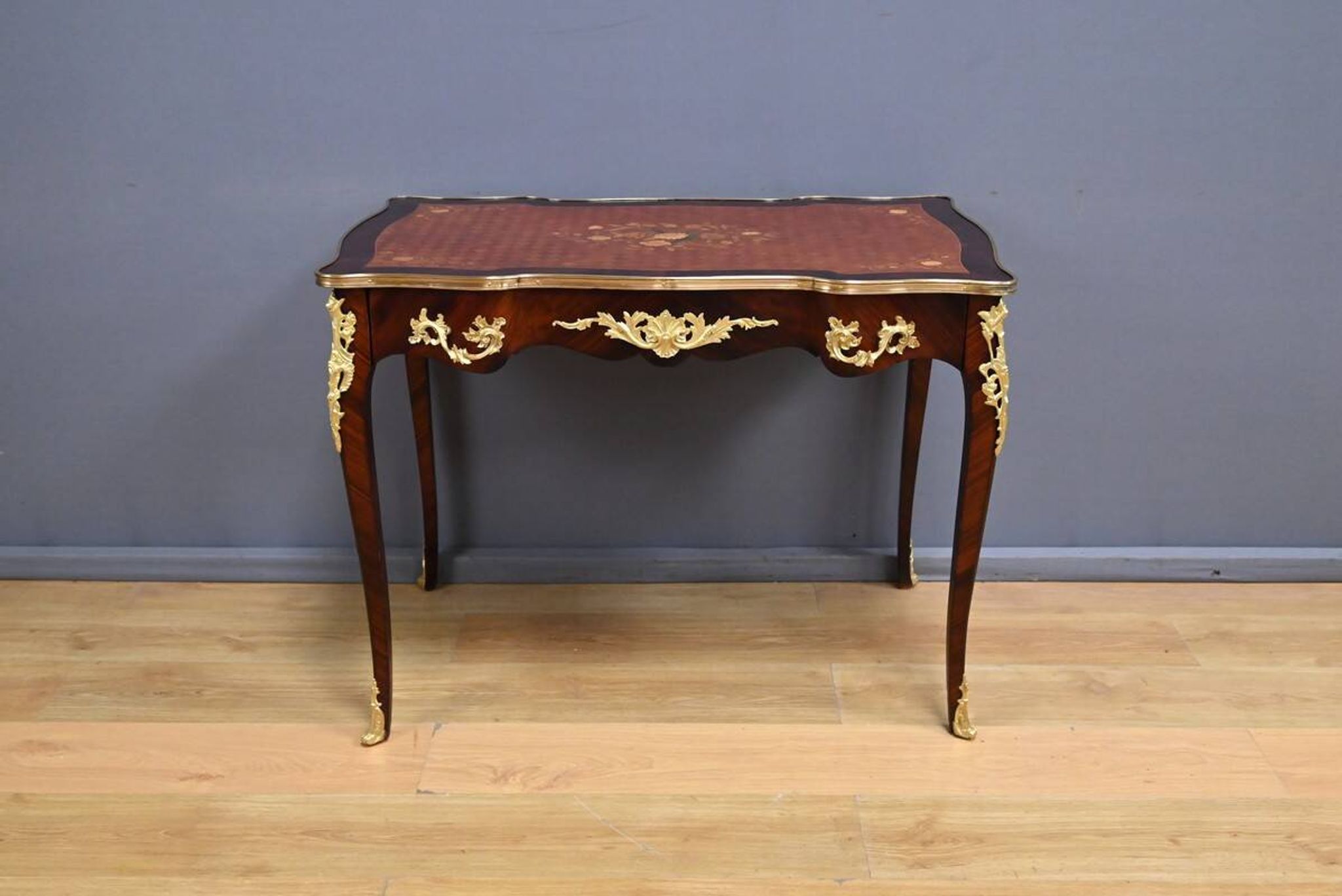 Rosewood, mahogany, and rosewood desk-table, Louis XV style – early 20th century.