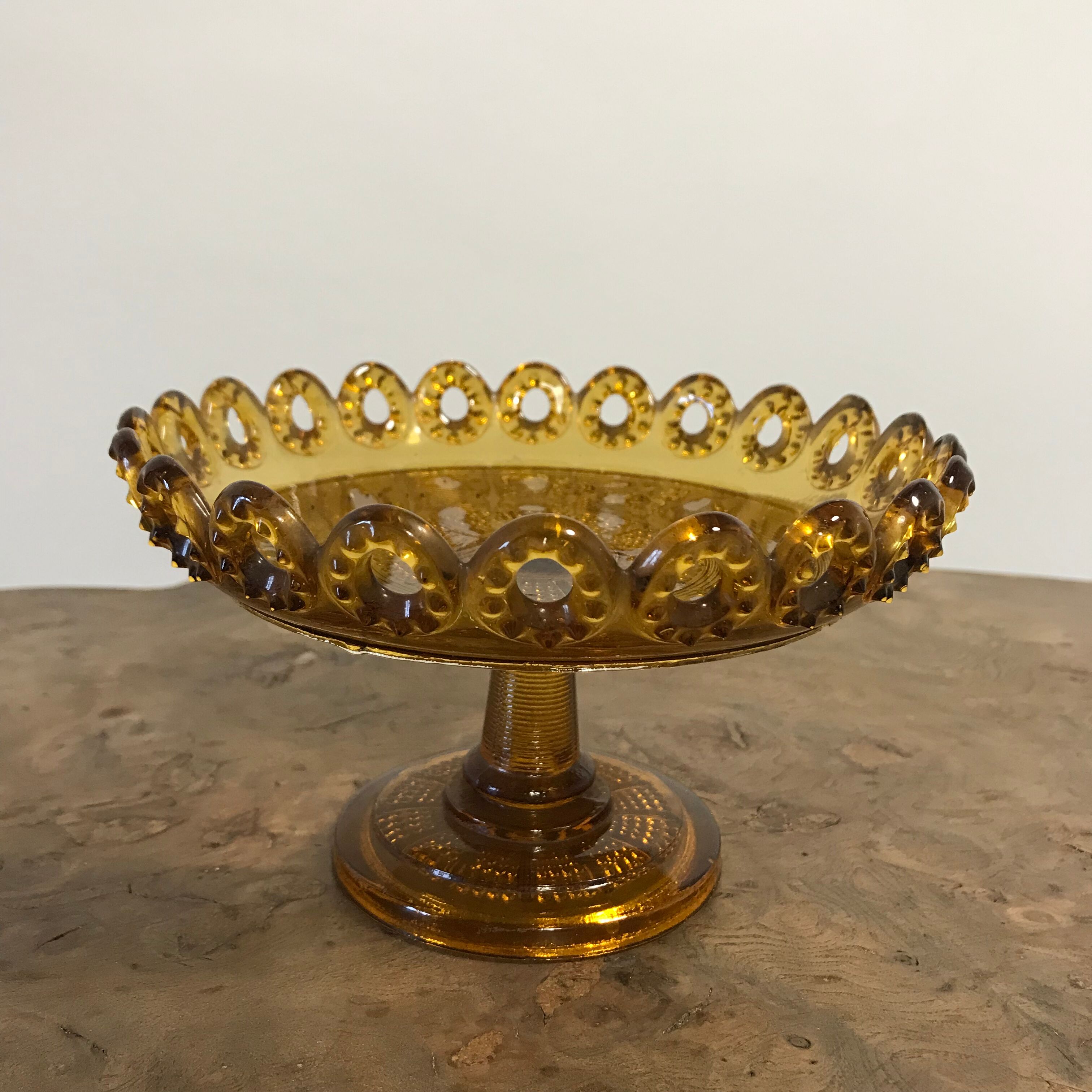 1900 fruit cup in amber pressed glass.