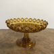 1900 fruit cup in amber pressed glass.