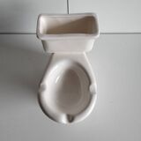 Atypical ashtray in the shape of a toilet