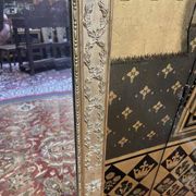 Louis XVI style mirror in gilded wood
