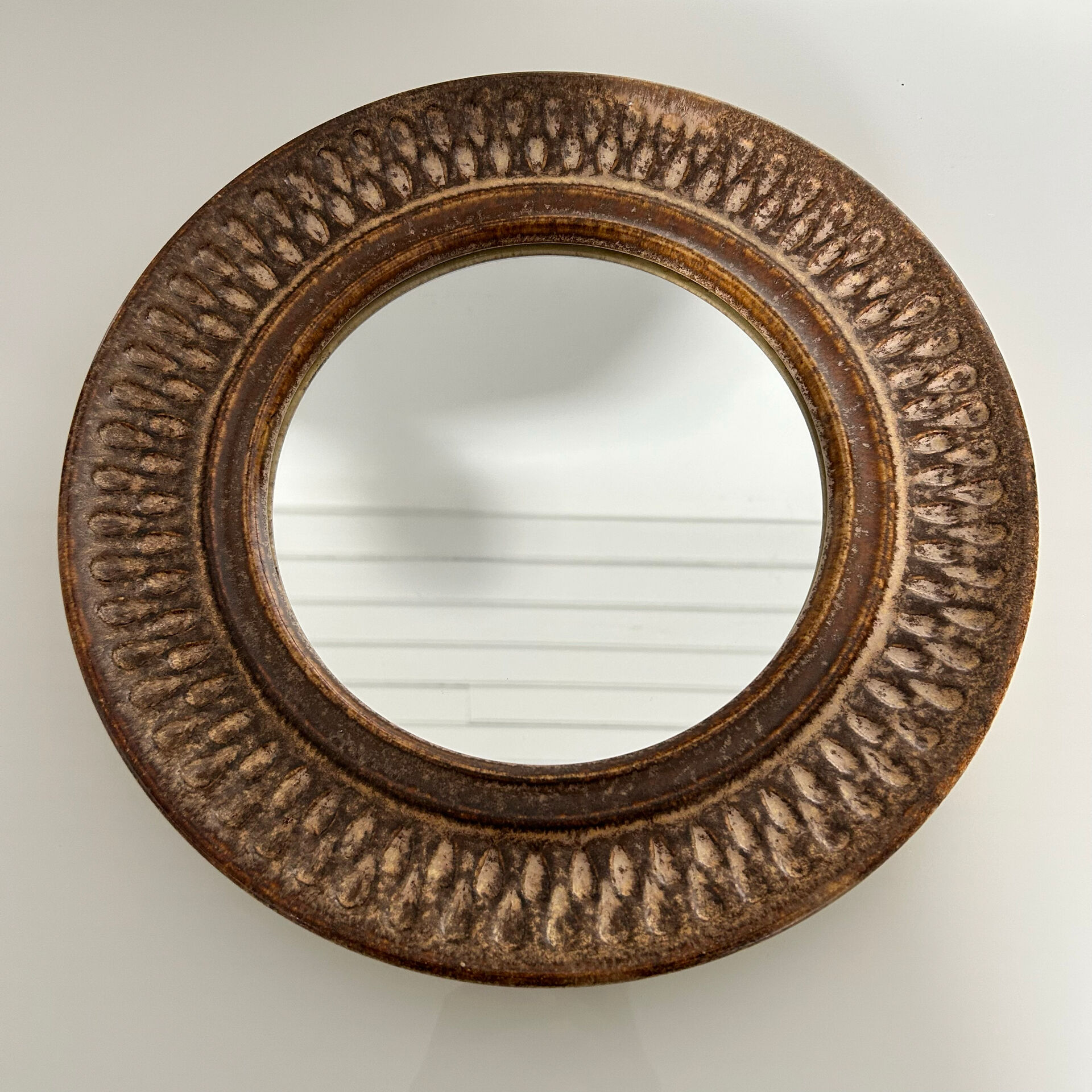 Chiselled stone mirror