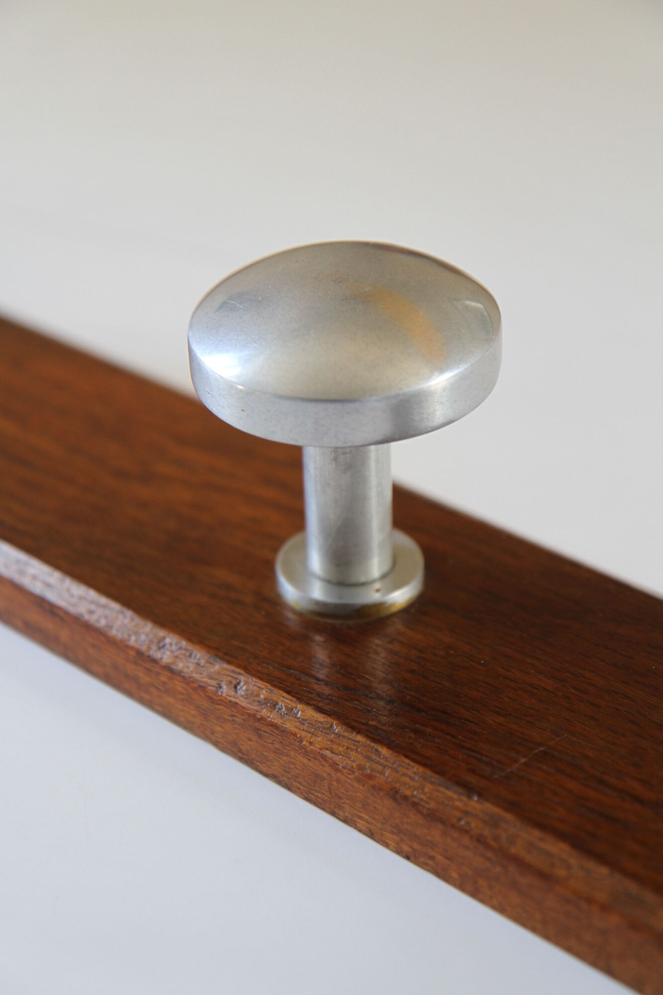 Wooden and stainless steel coat holders from the 1920s