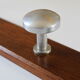 Wooden and stainless steel coat holders from the 1920s