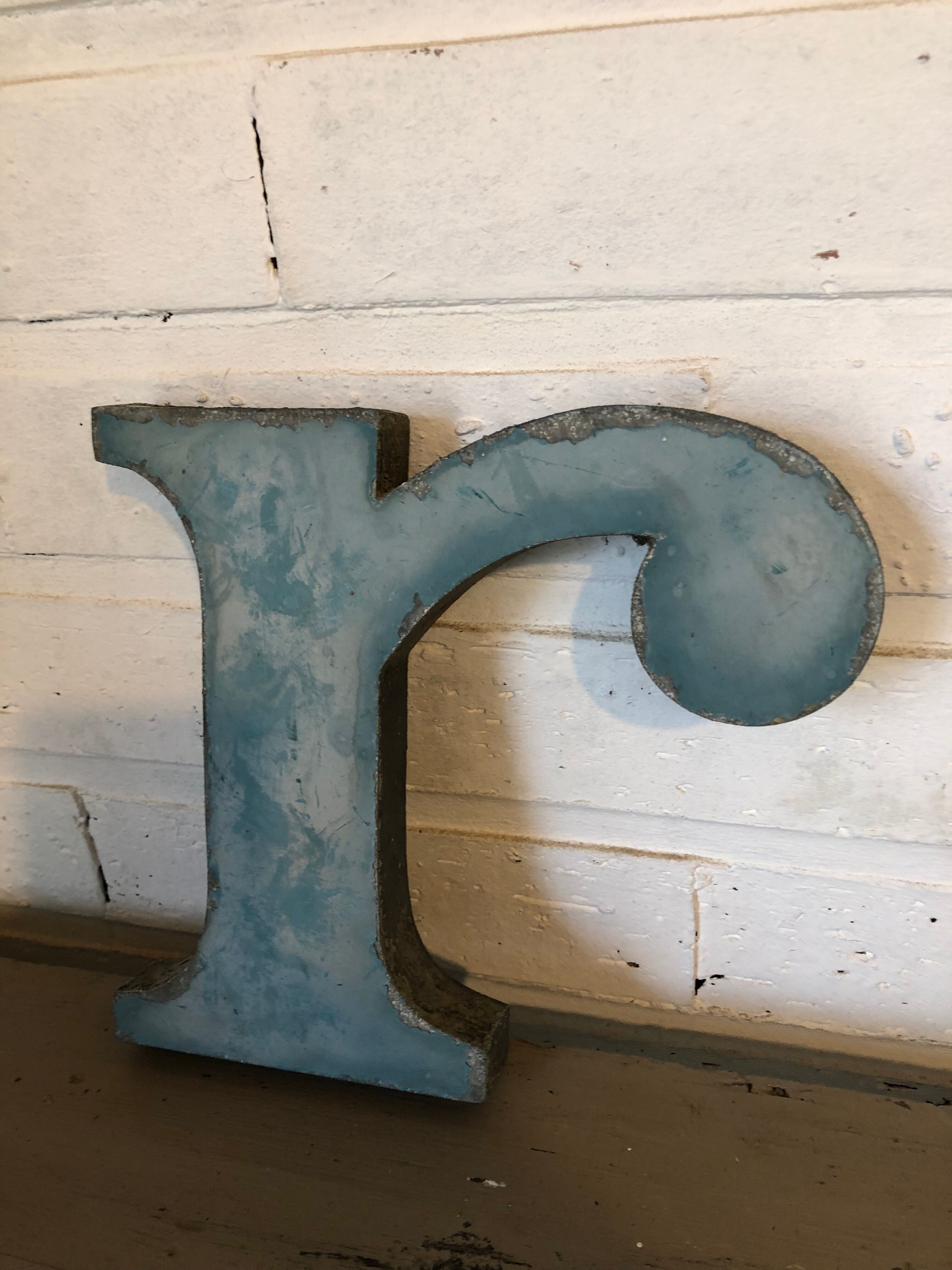 Blue sign letter "R"