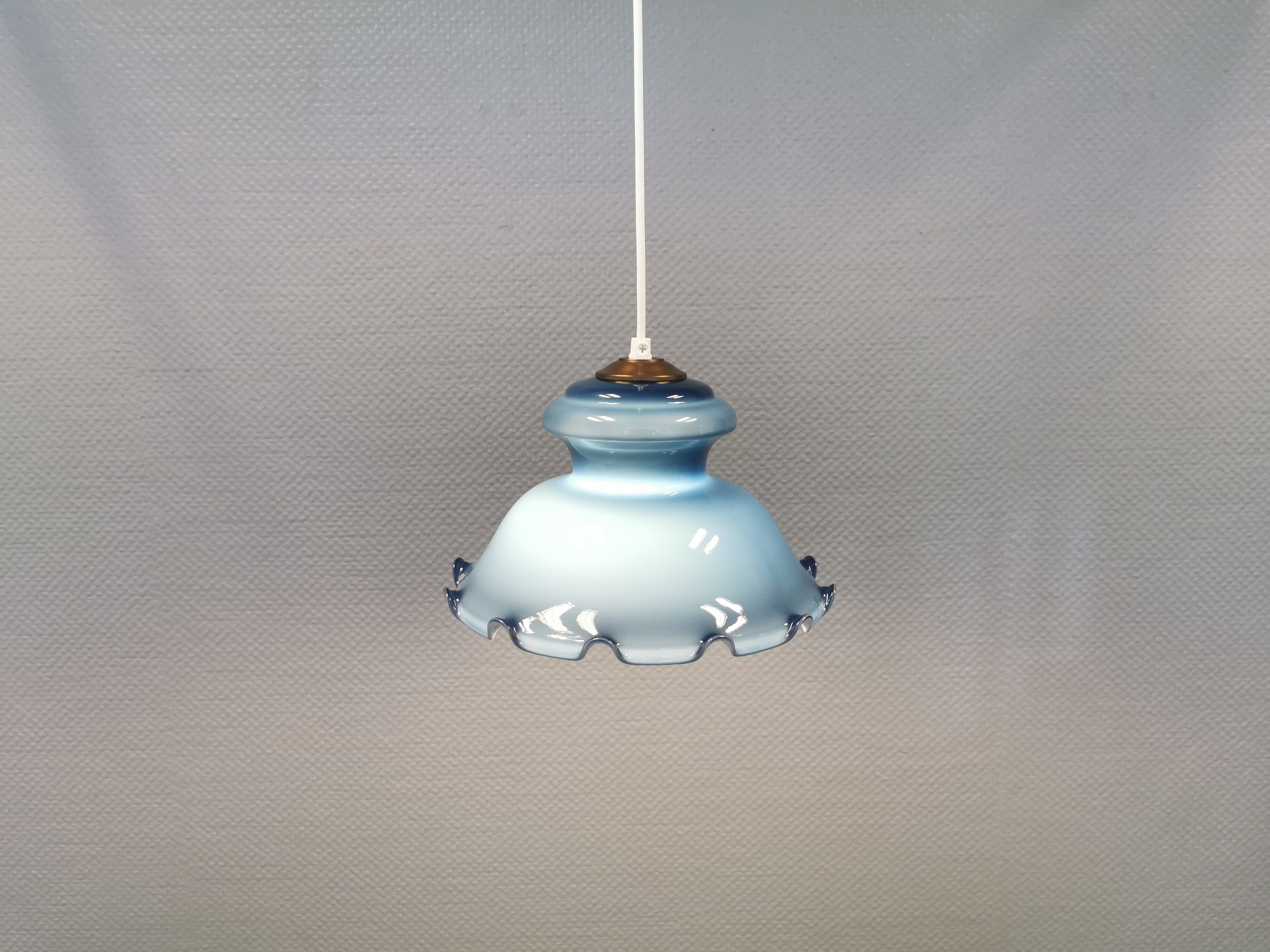 Hanging lamp in double layer opal glass, blue on the outside and white on the inside.