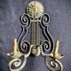 Pair of neoclassical wrought iron wall lights