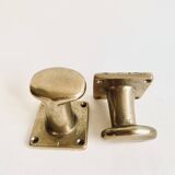 Pair of golden cast iron hooks