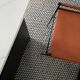 Artisan Contemporary bar stool, dark brown leather, black rubber metal.