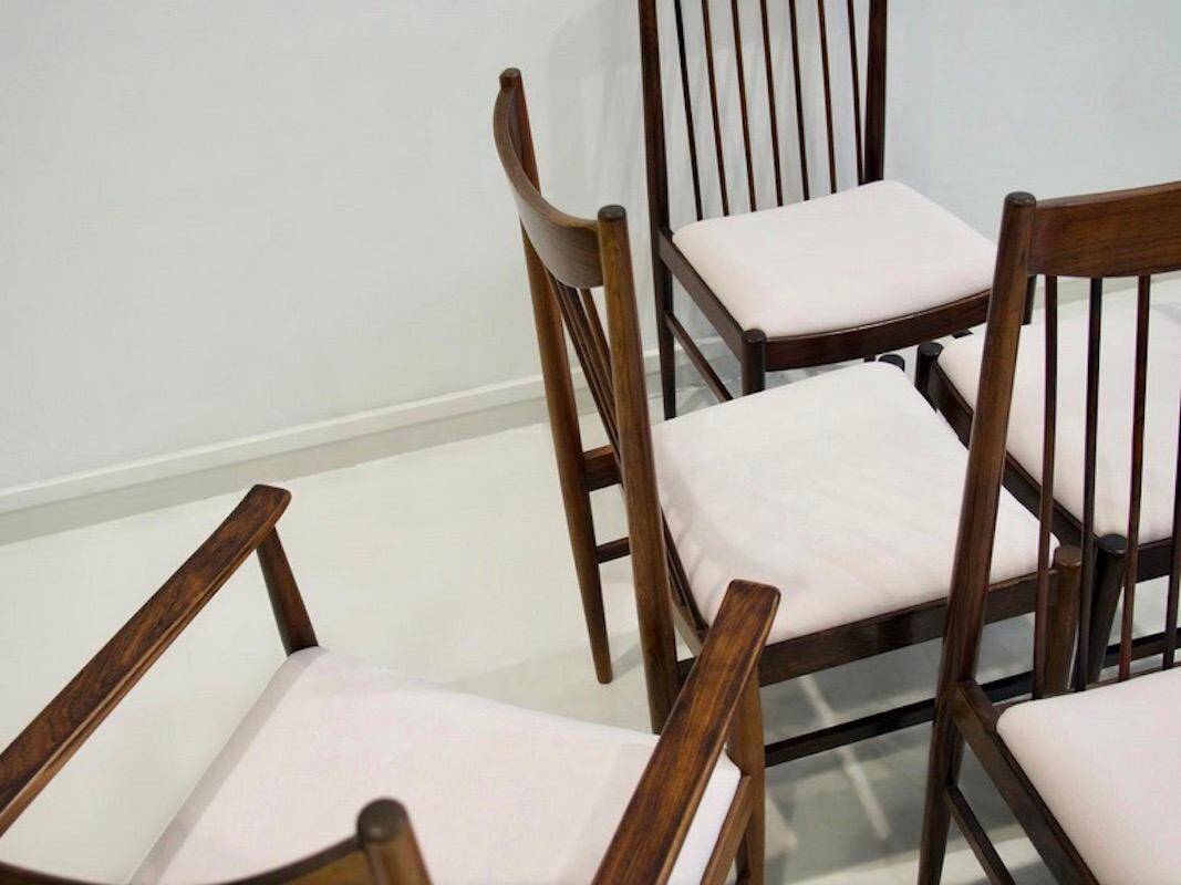 Set of six wooden dining chairs Arne Vodder Model No 422 with fabric upholstery.