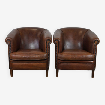 Set of 2 rugged sheepskin club armchairs with a stunning appearance in dark cognac color