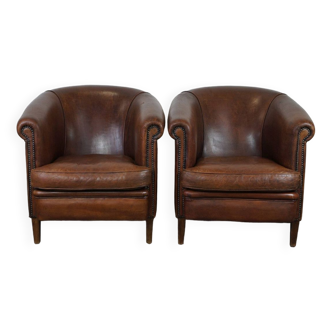 Set of 2 rugged sheepskin club armchairs with a stunning appearance in dark cognac color