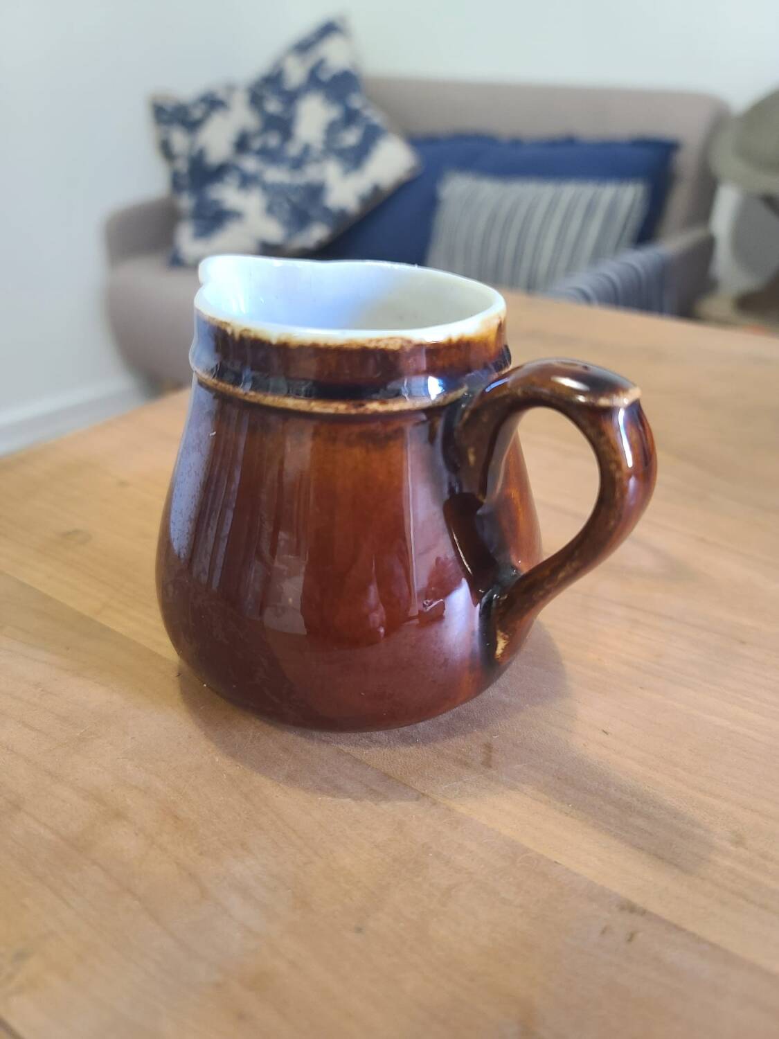 Brown ceramic milk jug
