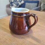 Brown ceramic milk jug