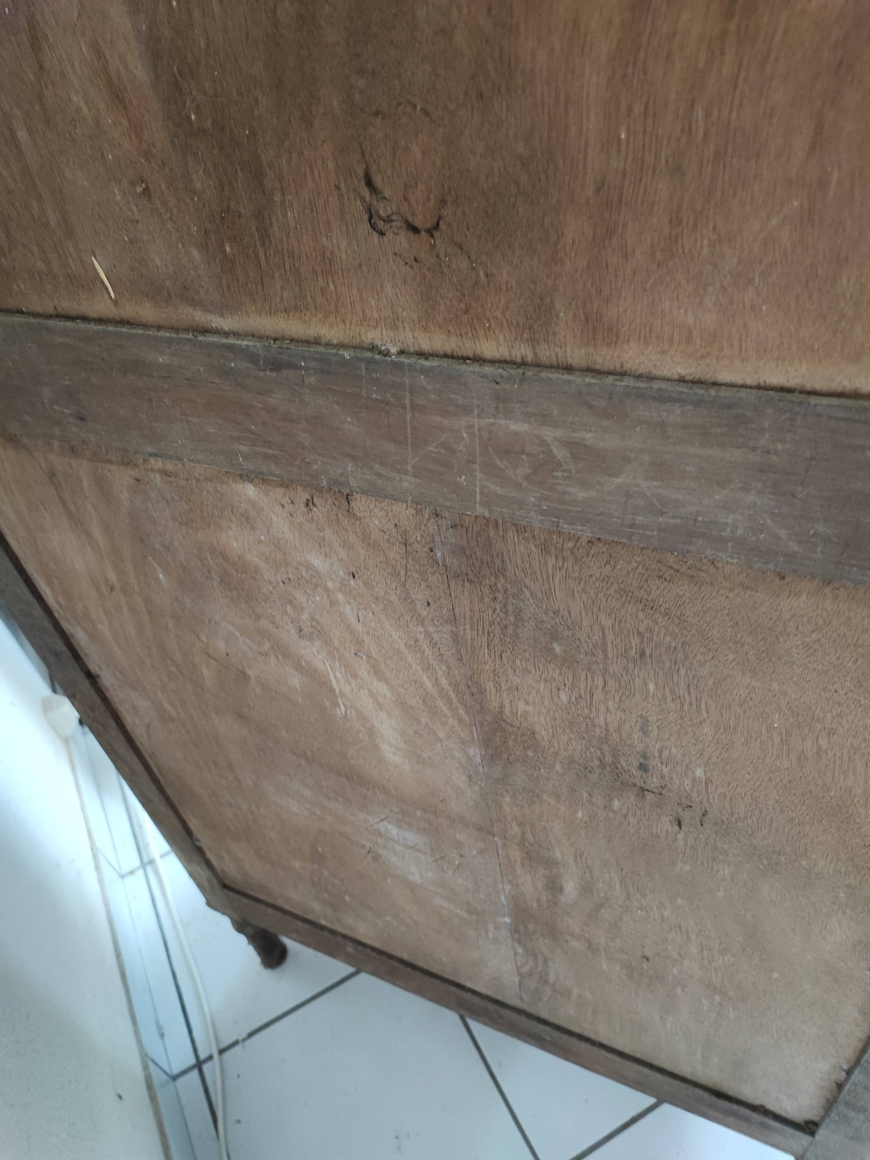 Bonnetière man standing cabinet a door