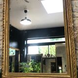 Old mirror 139cm/ 91cm Louis-Philippe with pediment period early 19th, presence of gold leaf.