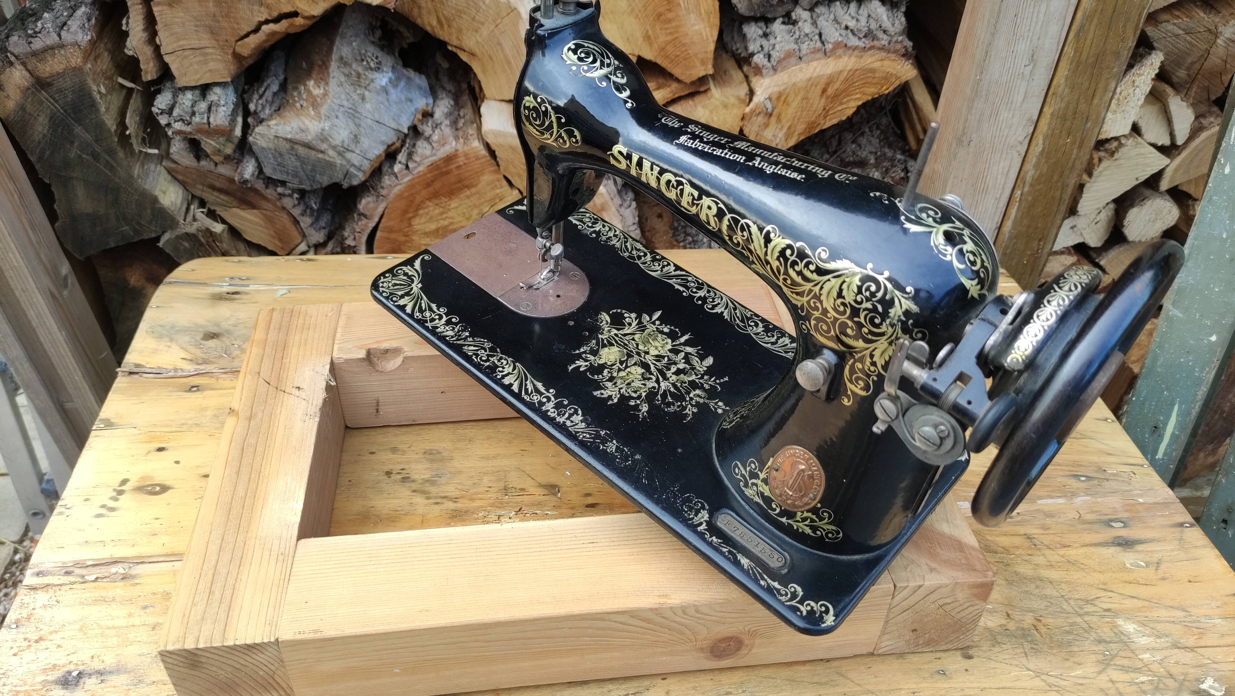 Old Singer sewing machine on pedestal